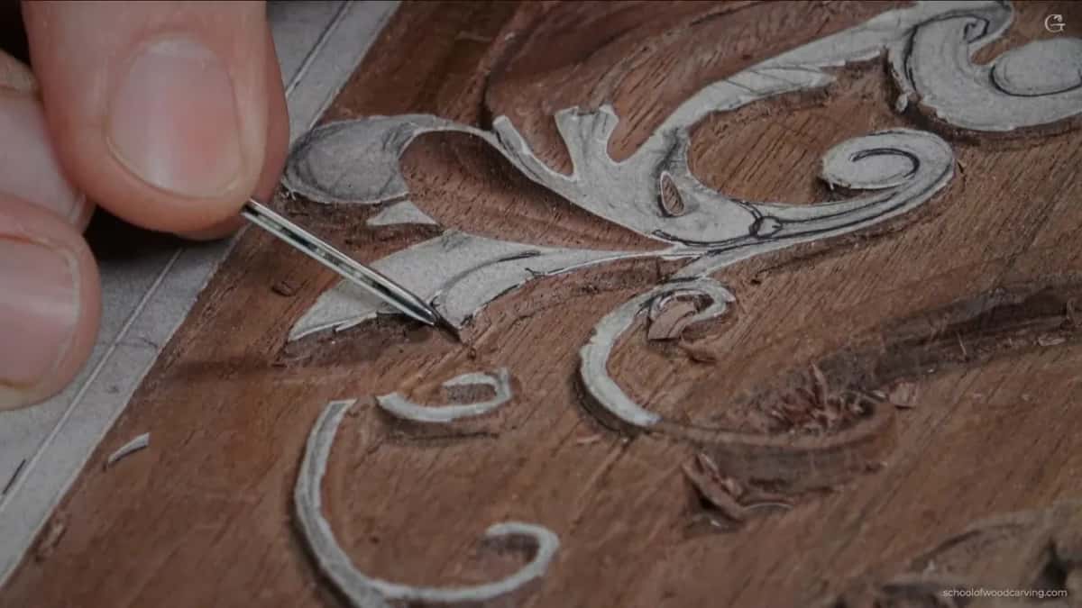 Needle-thin veiner at a paper scroll