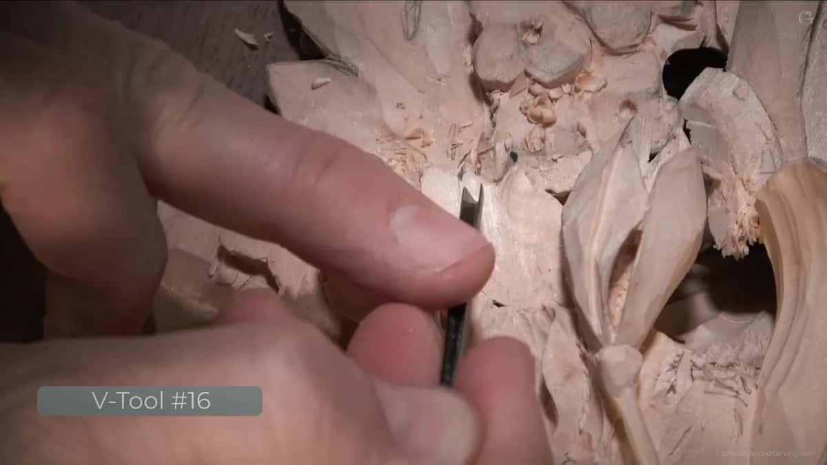 V-Tool #16 on the card, the tool held upright between thumb and finger