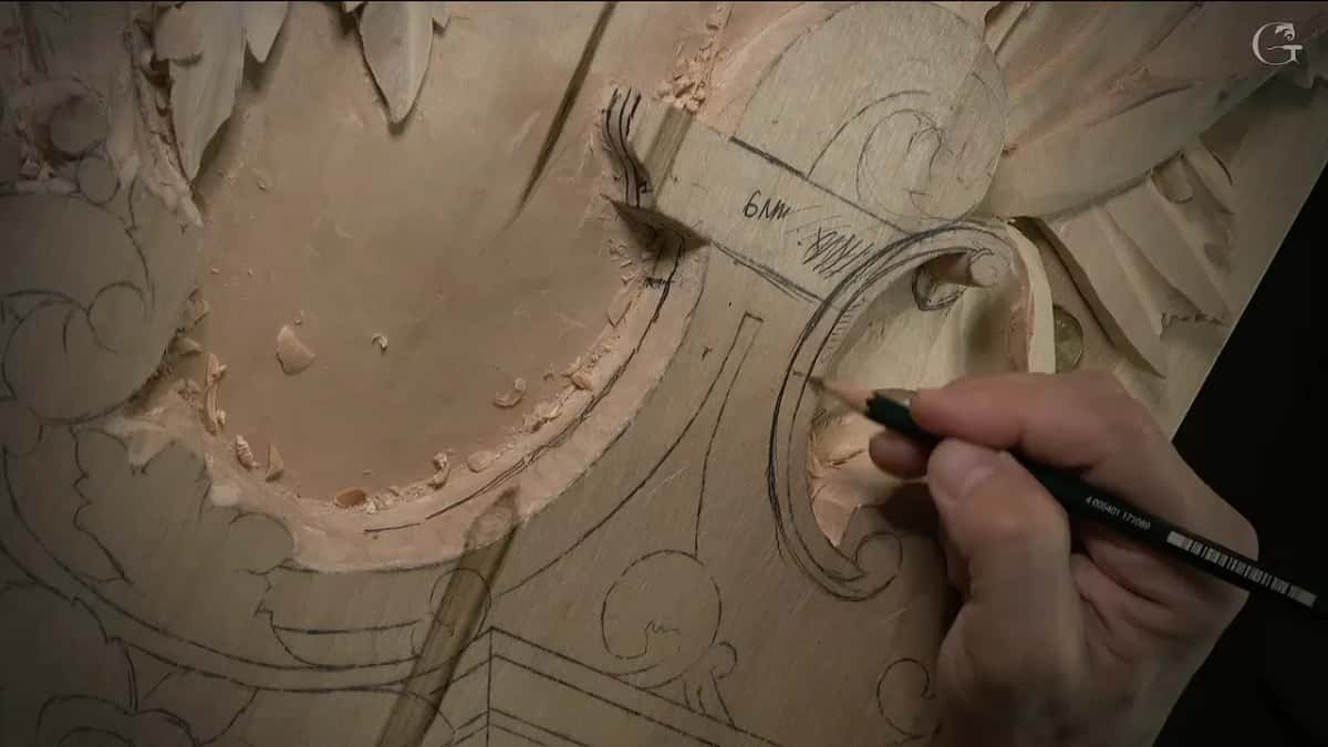 A pencil traces the curl of a volute next to a note on the wood that reads 6 mm