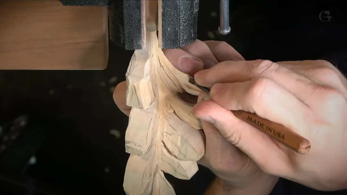 Palm tool marked Made in USA hollowing the inside of a leaf
