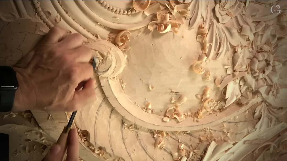 Overhead view of one hand working the scroll
