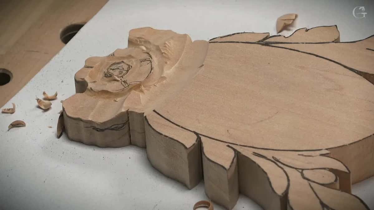 Small flower at the end of the blank, roughed out, chips lying beside it