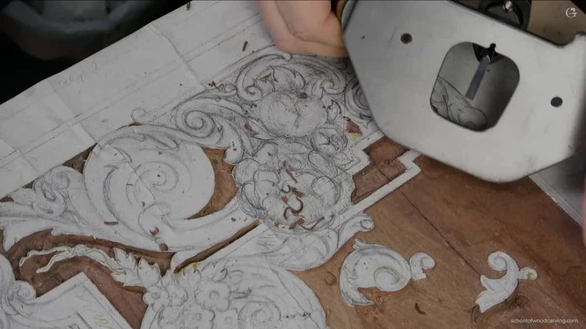 Steel base of the plane over the drawing, two small holes in it and the blade showing through the opening