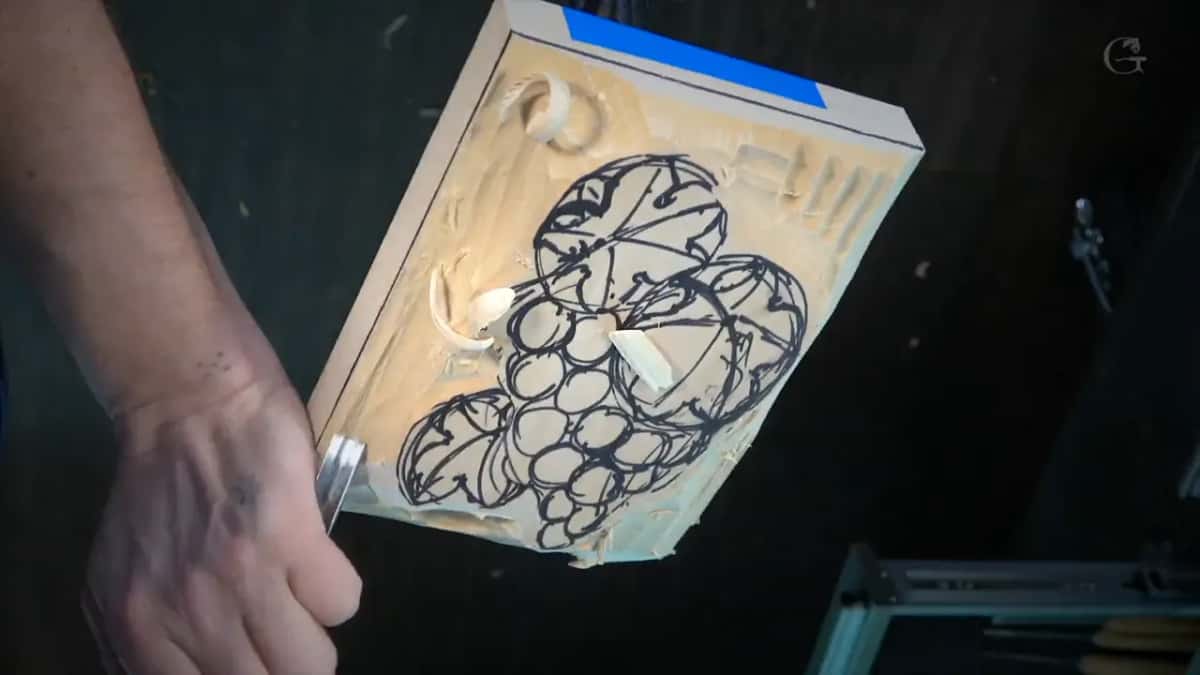 Grapes and leaves outlined in black marker, the first chips already out at the top