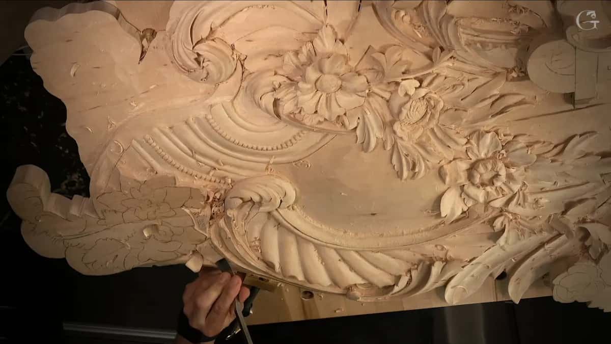 Hands low at the bottom edge, flowers above