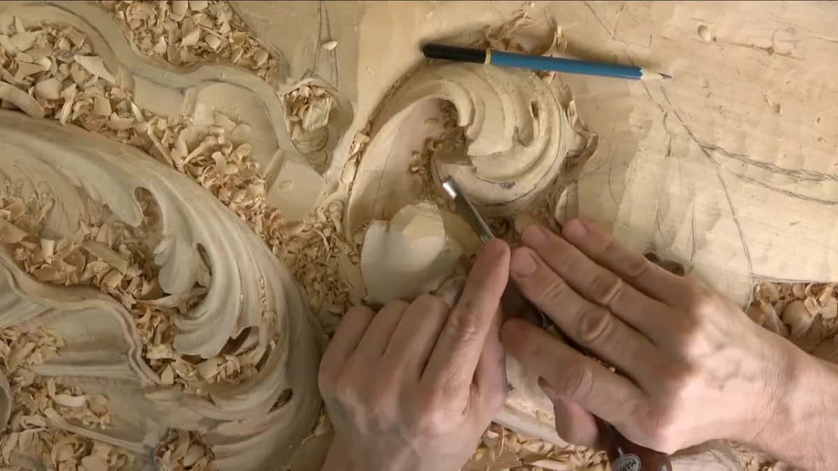 Along the center of a lobe, a thin gouge works under steady fingers.