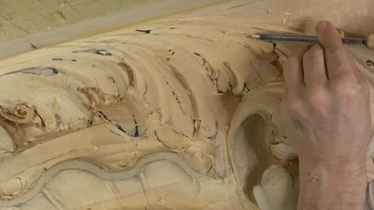 A thin tool rests against the top edge of the leaf.