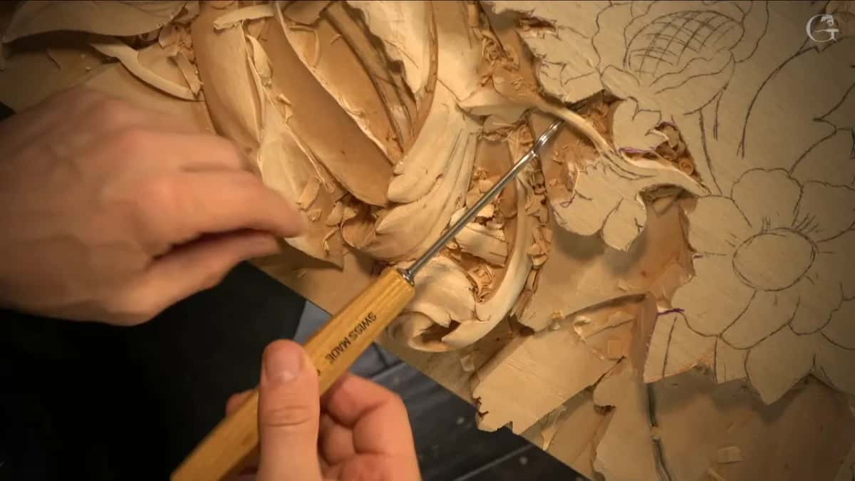 Thin shaft reaching toward the tight center of the scroll.