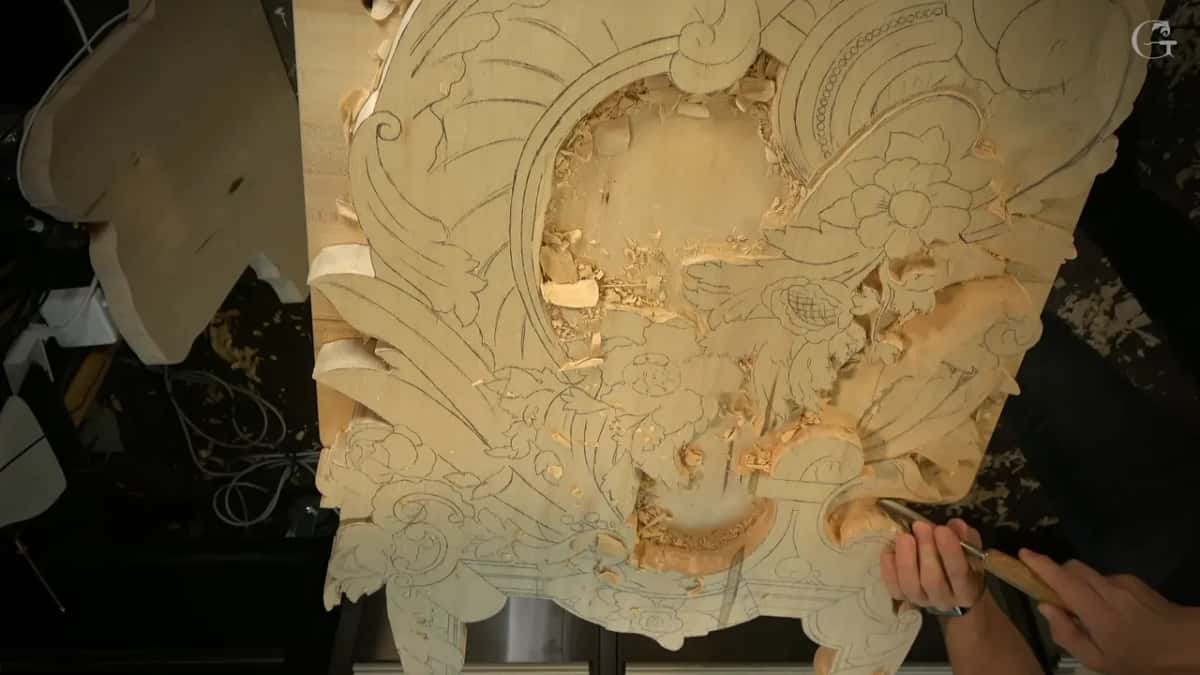 From high above, the whole board, with curved rays sweeping around an oval opening and flowers still in pencil.