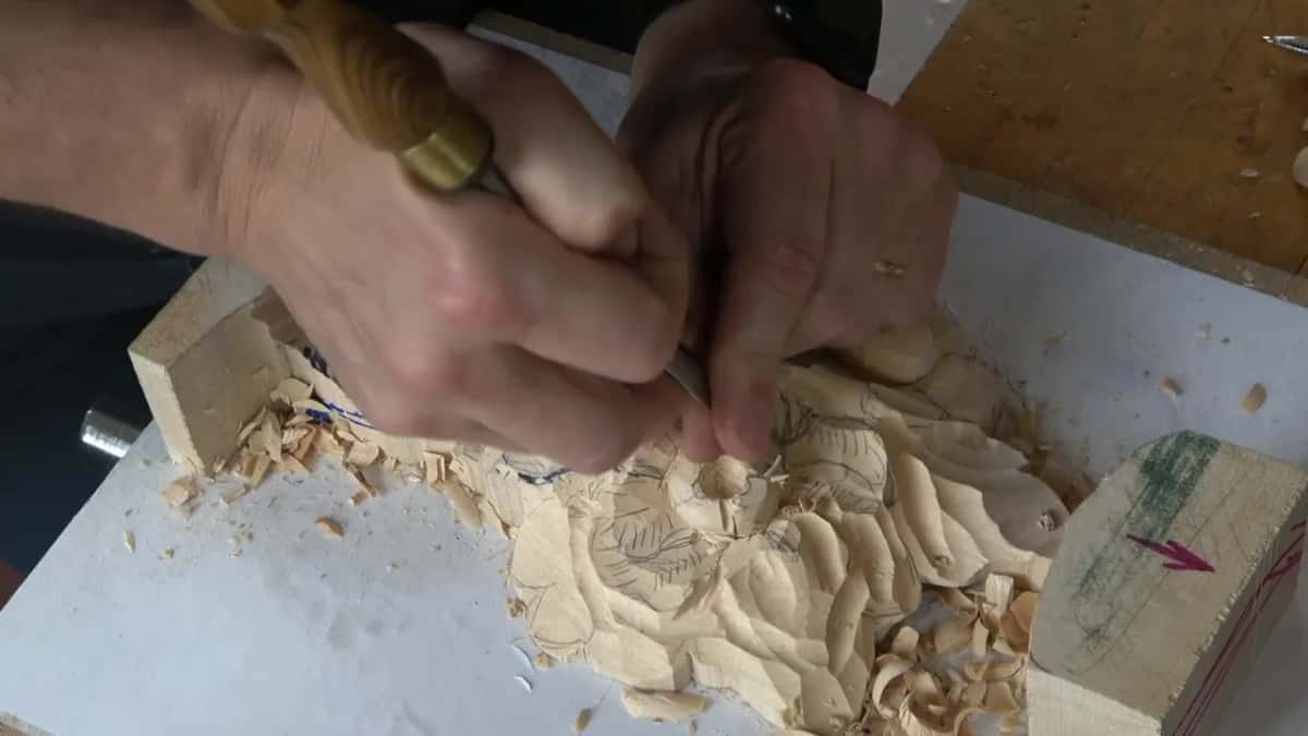 Both hands on the tool, blending where one part meets the next