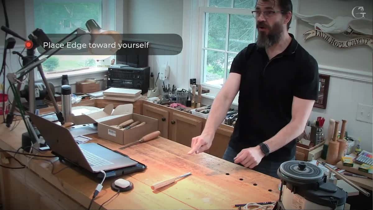 On-screen card reading Place Edge toward yourself while he points at the bench