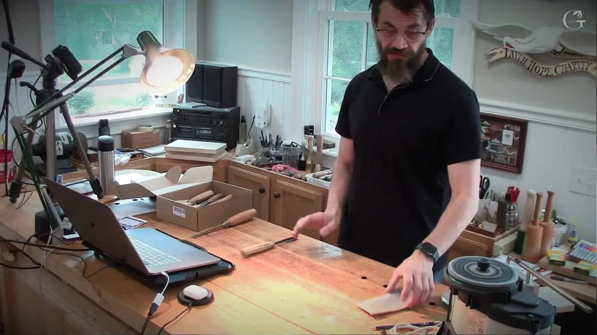 Flat pad under one hand at the front edge