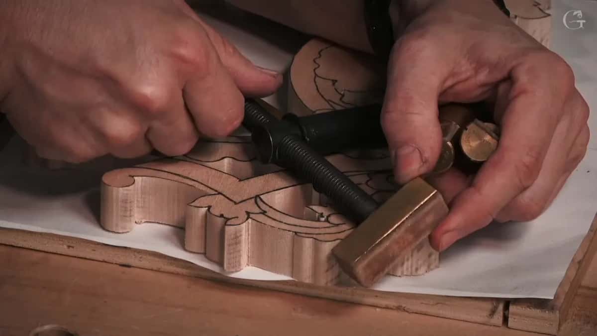 Hands setting a brass screw stop.