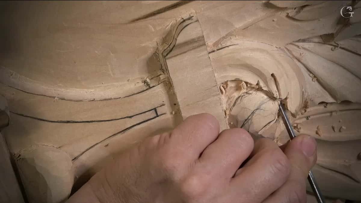 Thin tool in the right hand at the eye of the leaf