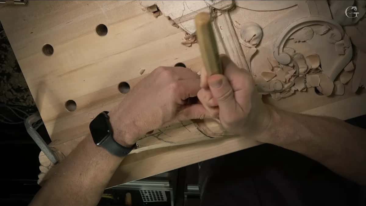 Light handle in one fist, the other hand guiding the steel near the leaf tip