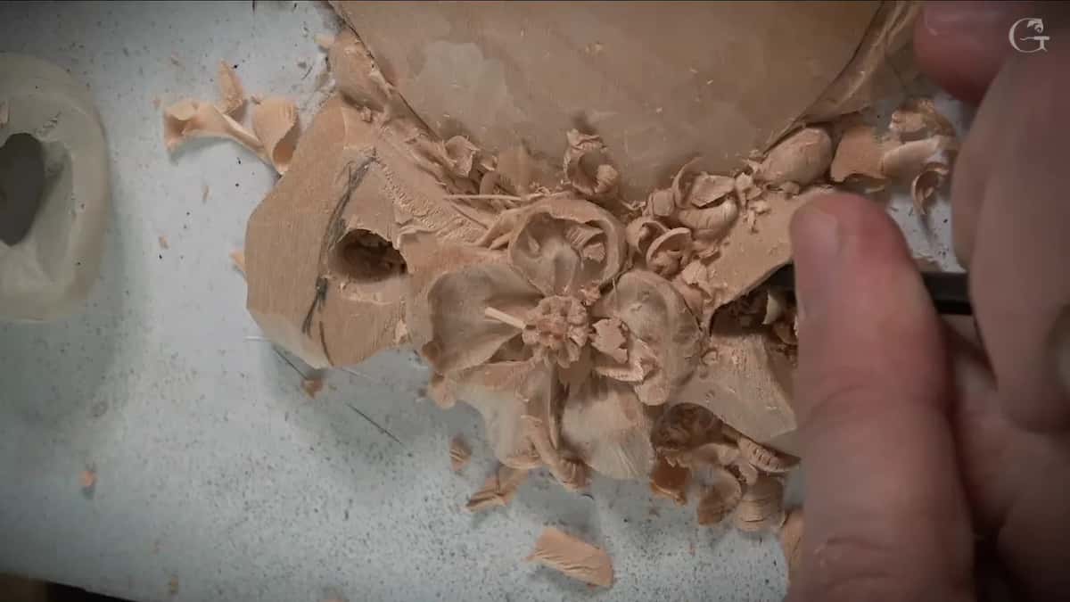 Gouge going in beside the right loop, with the clay model at the left edge of the frame