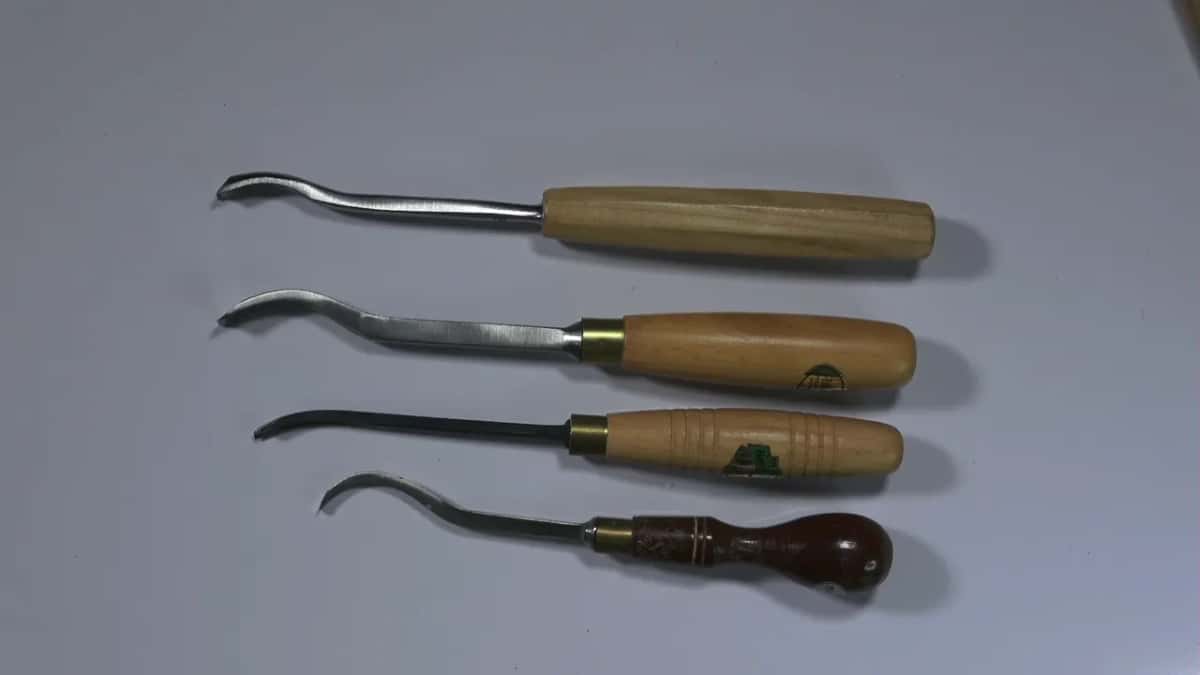 Four bent tools, four handles