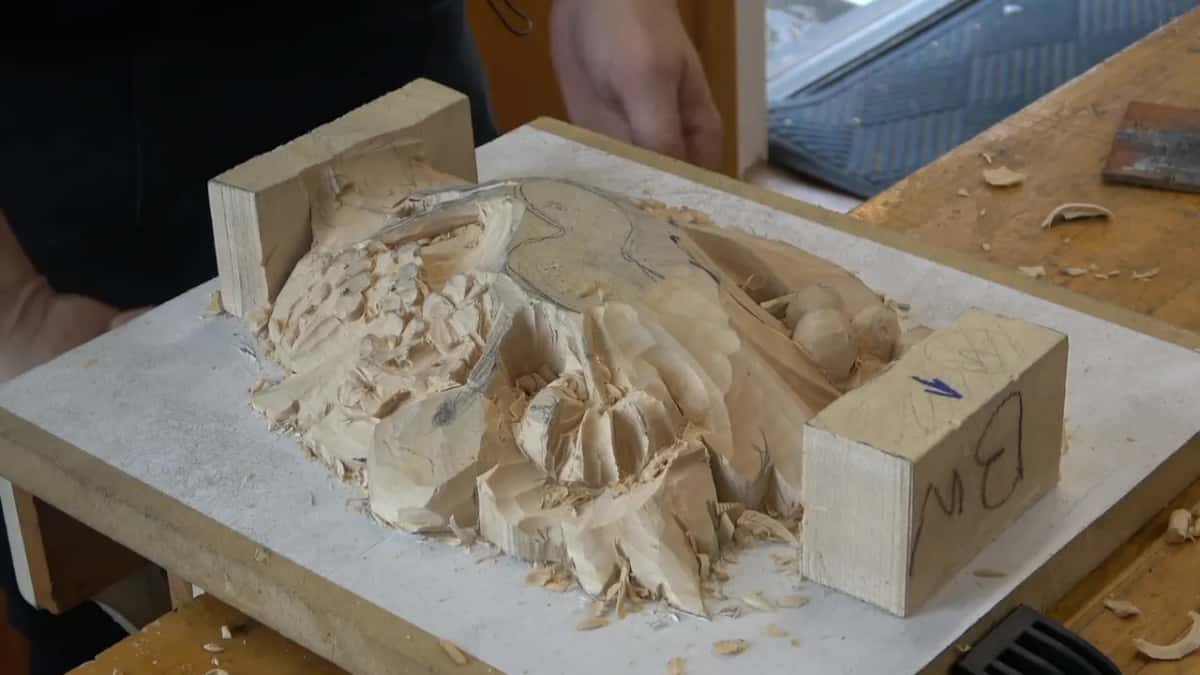 Lower layer near the end of class 5, rounded forms carved, pencil lines still on top