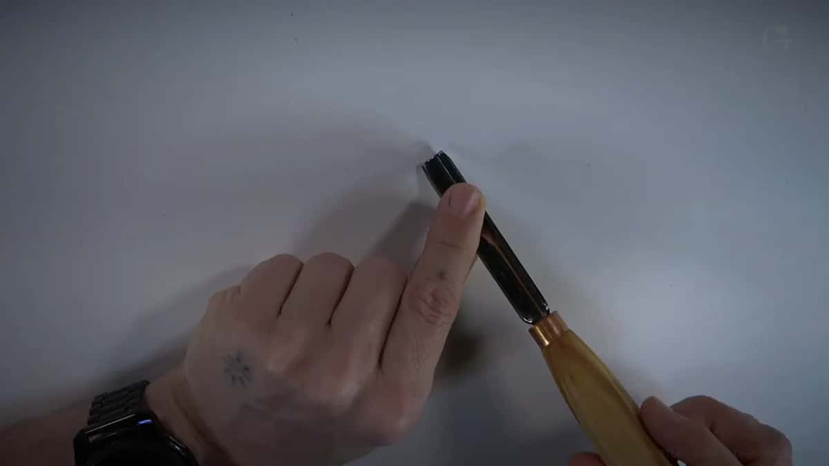 Brass colored ring where the steel meets a light handle