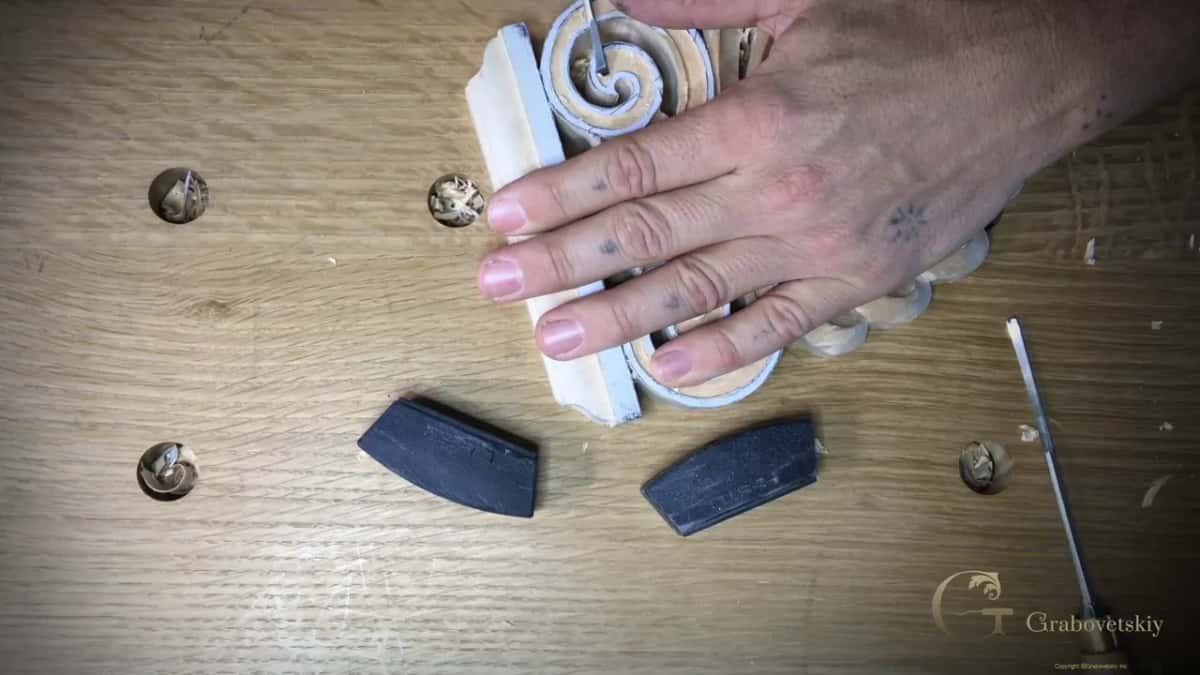 Flat hand holds the block over a sunk swirl channel