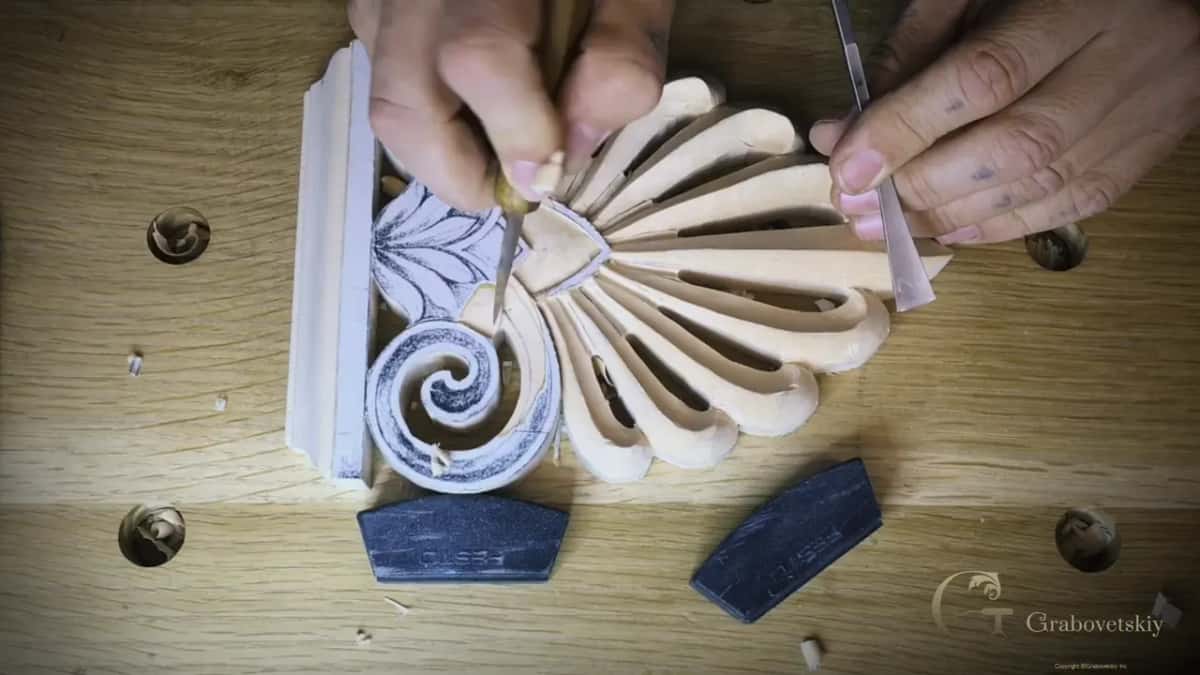 Two tools at work in the middle ground, with the small leaves and both swirls still under the paper pattern