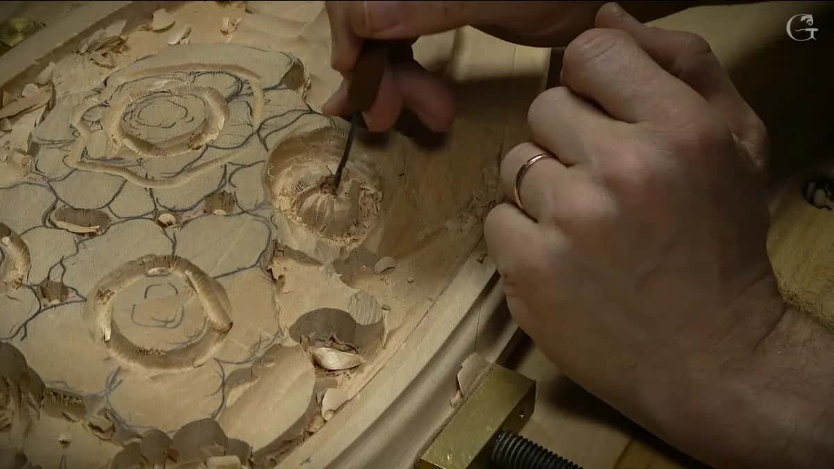 Small tool working inside a flower, chips all around