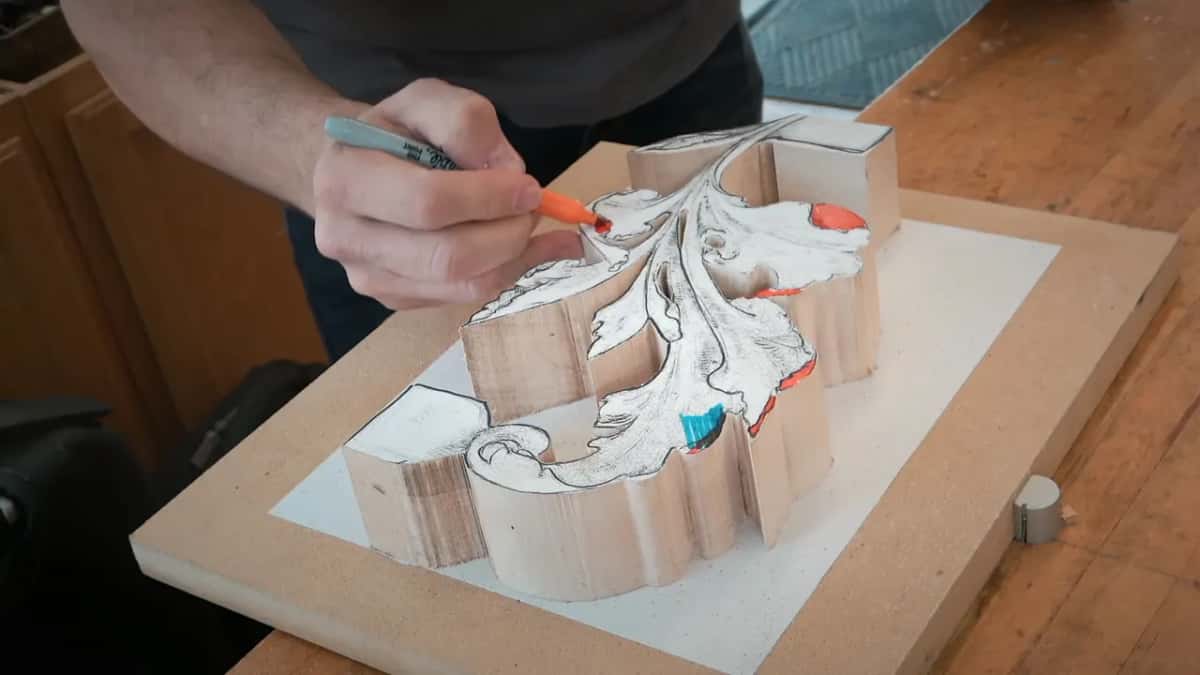Orange color going onto the paper pattern, with a blue spot already marked beside it