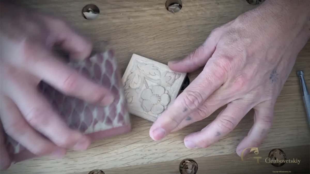 Pink sanding block next to the rosette