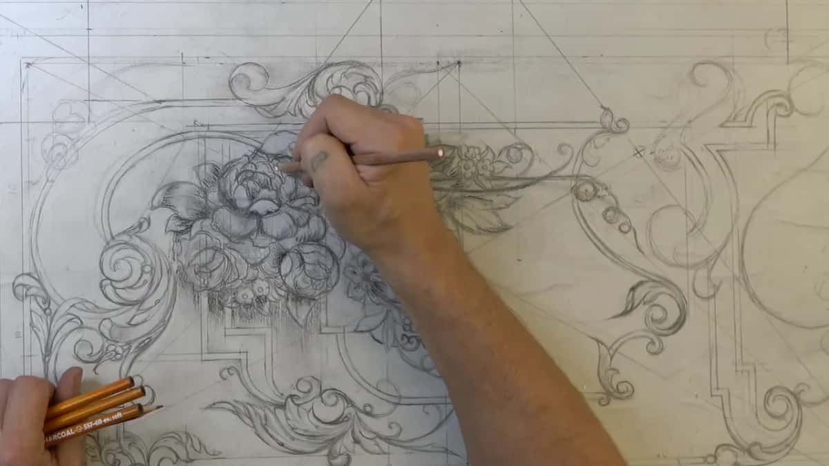 Pencil darkening the shadows inside a drawn flower bouquet